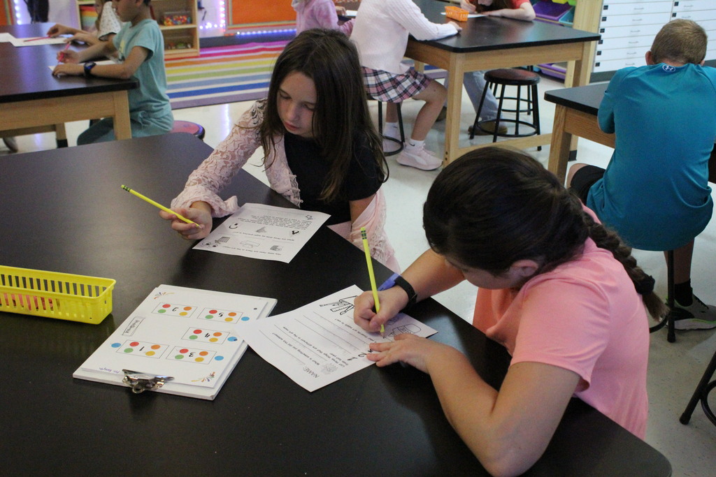 A picture showing students in Mrs. May's art class working through a sheet to familiarize themselves with her classroom.