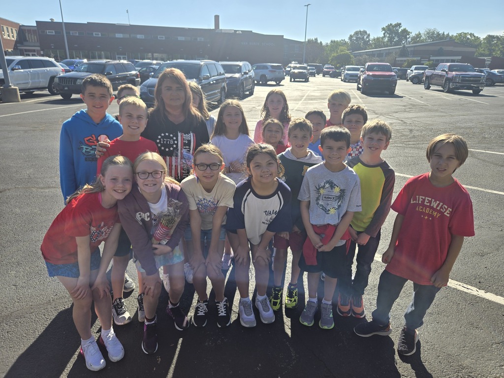 A picture of the fourth graders who helped place flags in honor of 9/11.