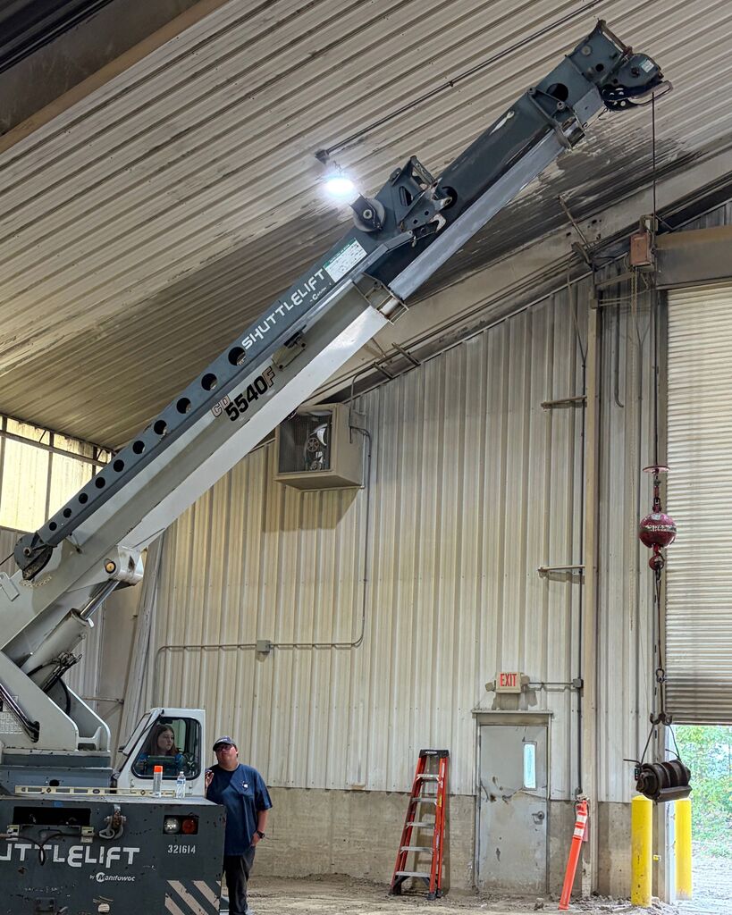 A picture of a student operating a crane.