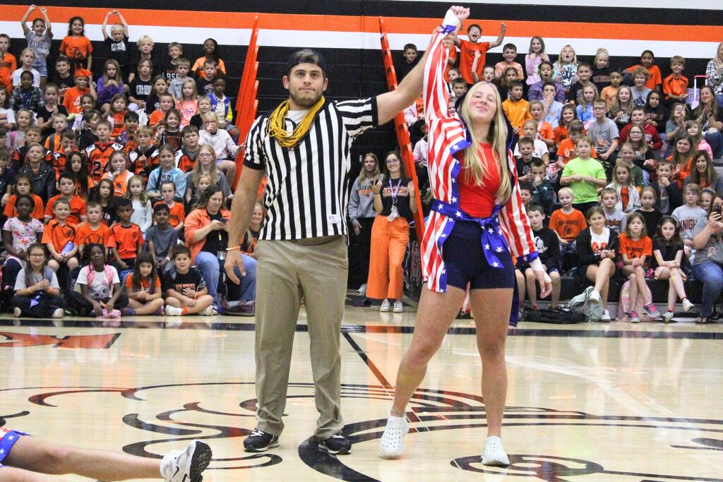 A picture of one of the homecoming court attendants being introduced at the pep rally.