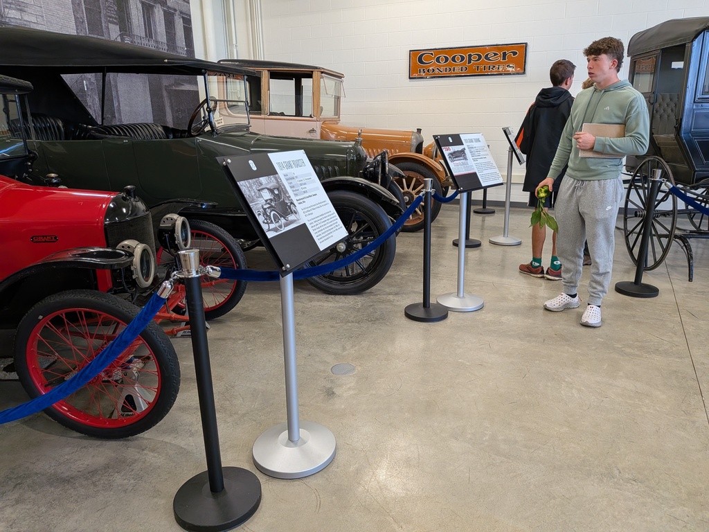 Students observe some of the cars found at the museum.
