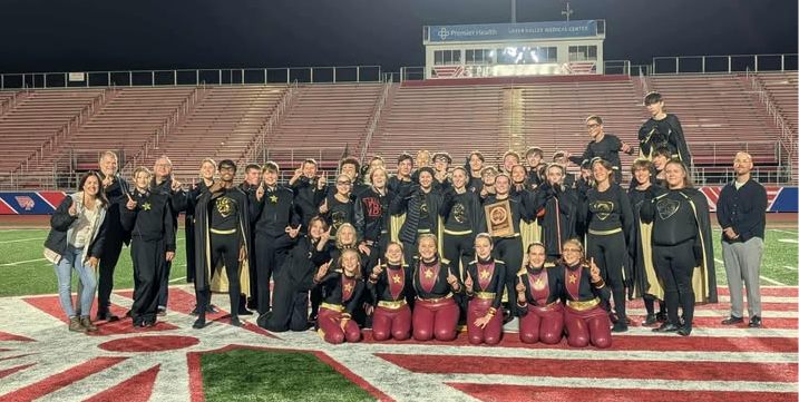 The marching band poses after earning a Superior (I) rating at the state contest.