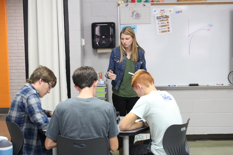 Mrs. Rachel Rader explains a problem to students in AP Calculus