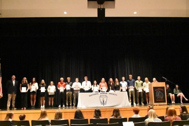 High school students inducted into NHS at the ceremony held in the auditorium.