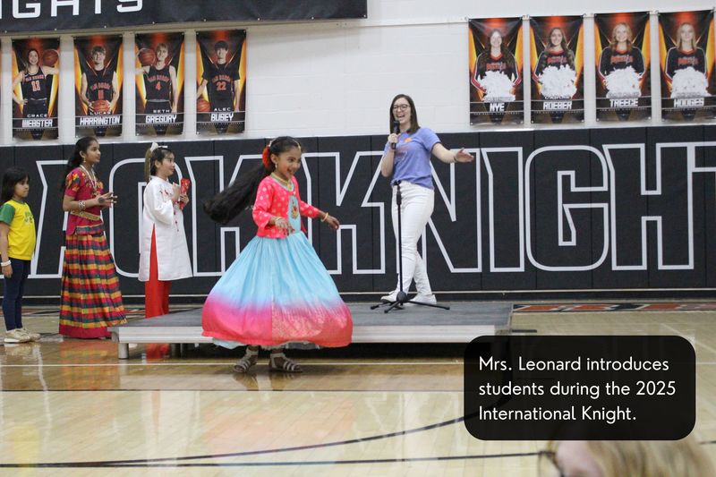 Mrs. Leonard introduces students during the 2025 International Knight.