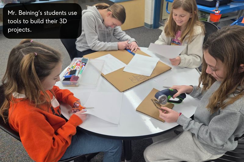 Mr. Beining's students use tools to build their 3D projects.