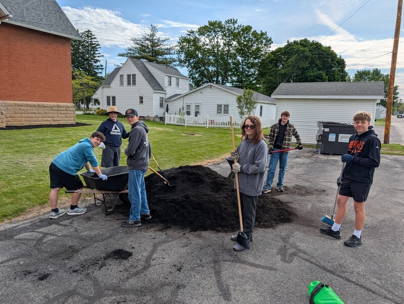 Students helped spread mulch at various locations around town.