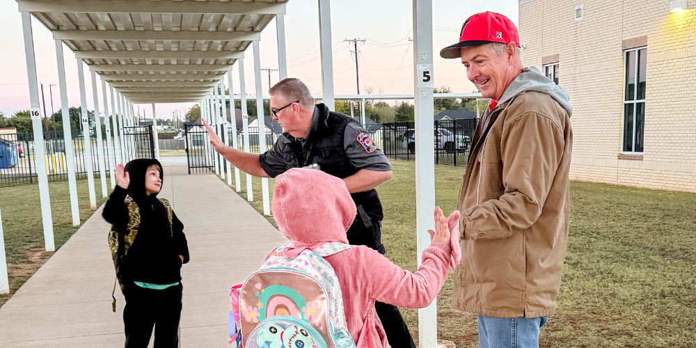 board members greeting students 