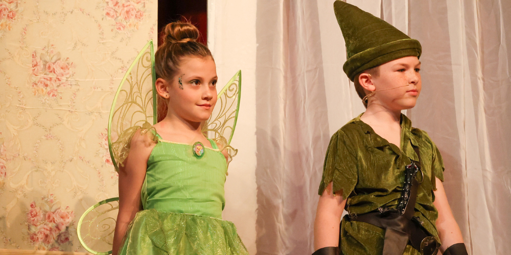 two students dressed as tinker bell and peter pan