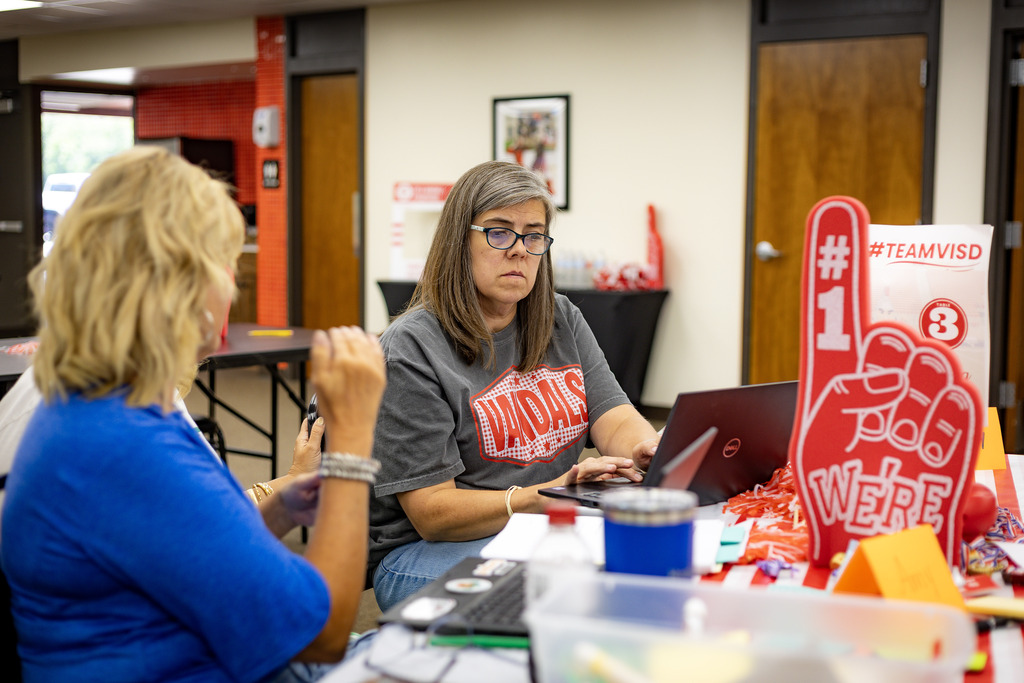 woman working at a table training