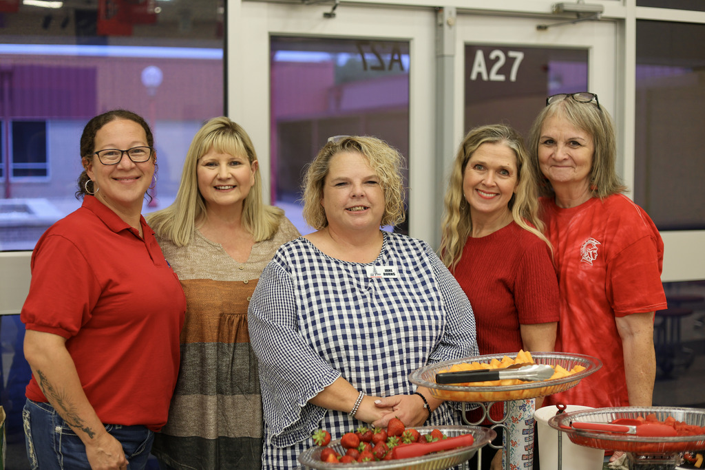 5 women in a cafeteria