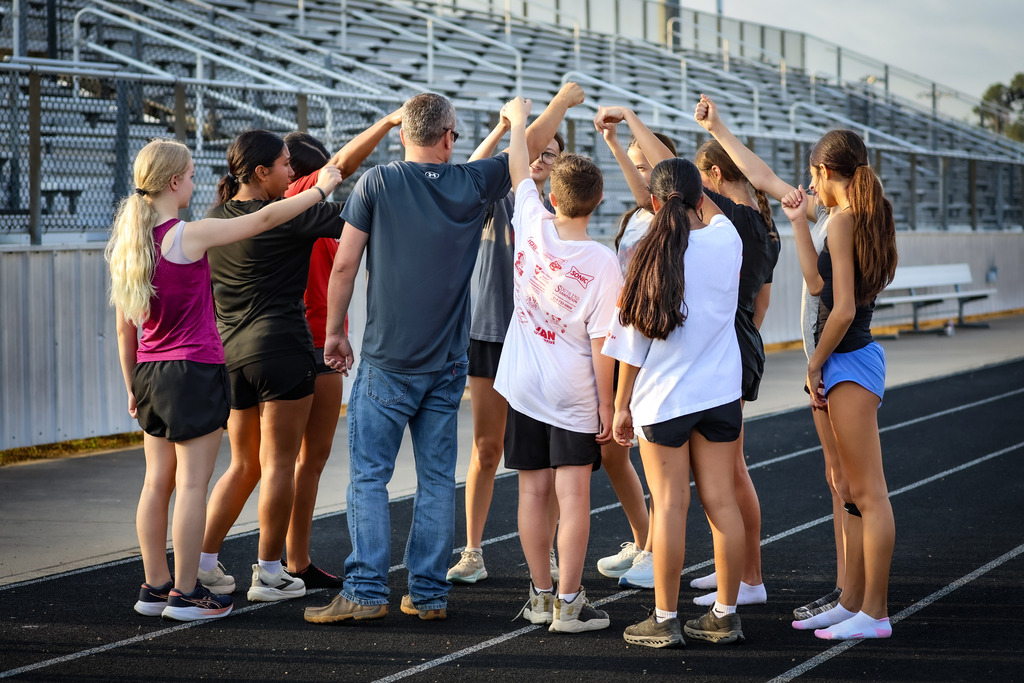 group of people breaking out a huddle