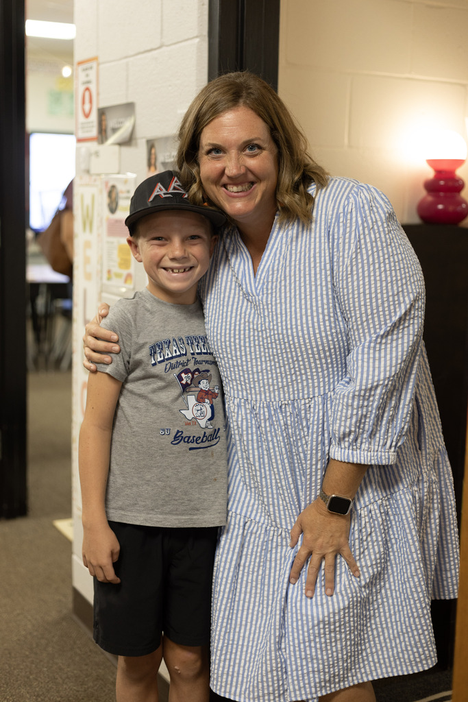 Teacher + student in doorway