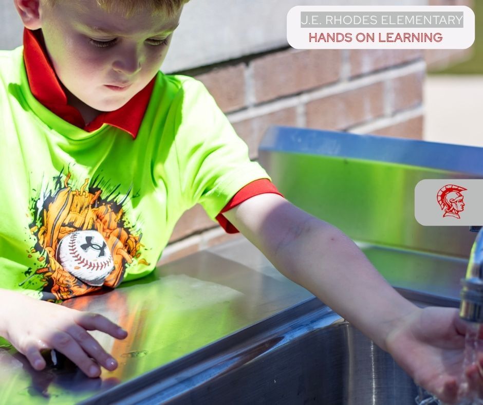 boy washing his hands