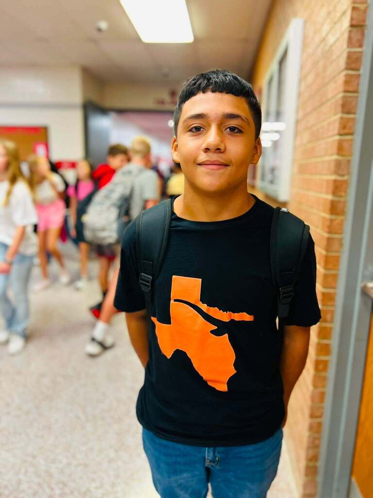 student in school hallway