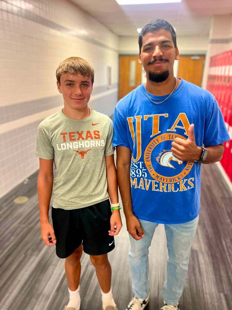 teacher + student in school hallway