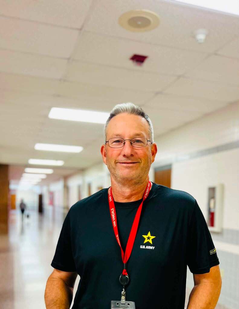 Coach in school hallway