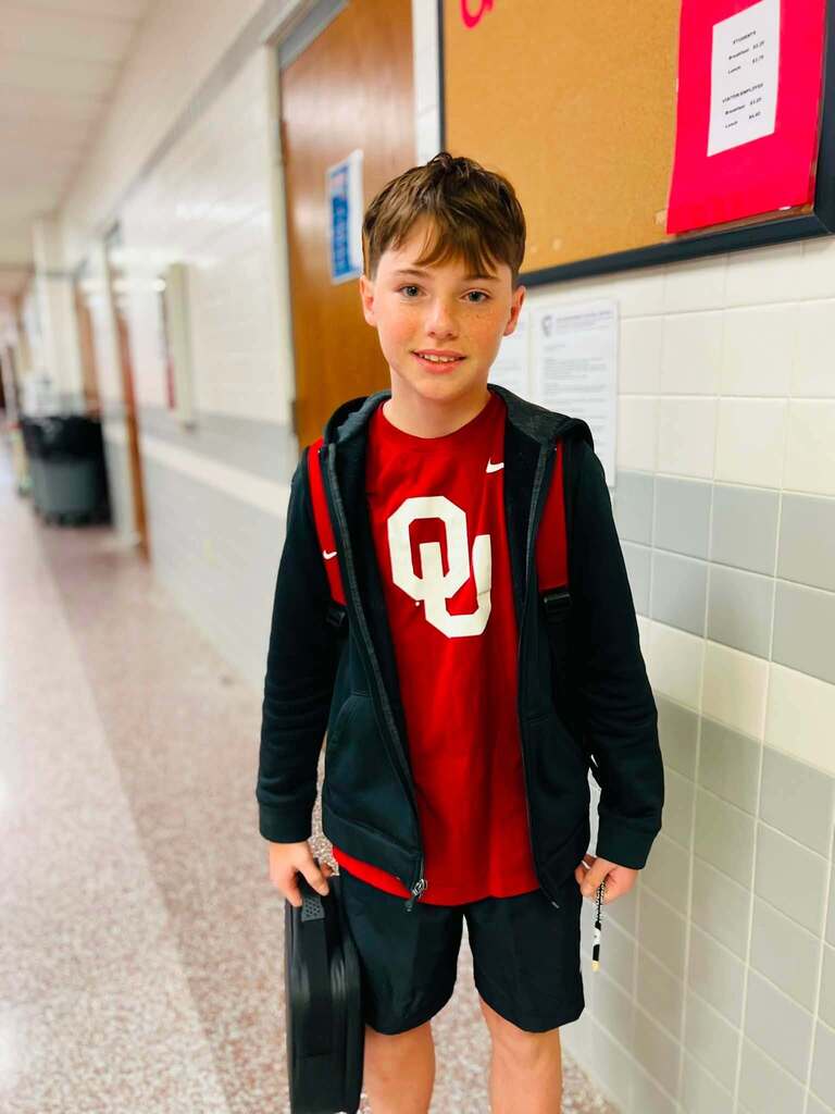 student in school hallway