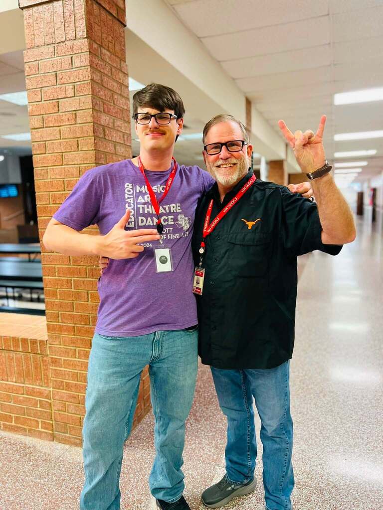 two teachers in school hallway
