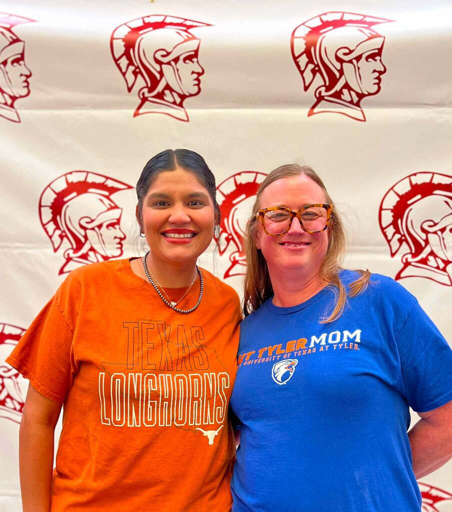 two teachers smiling at the camera
