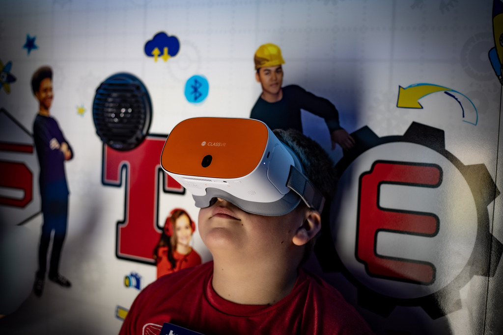 BOY WEARING VR GOGGLES