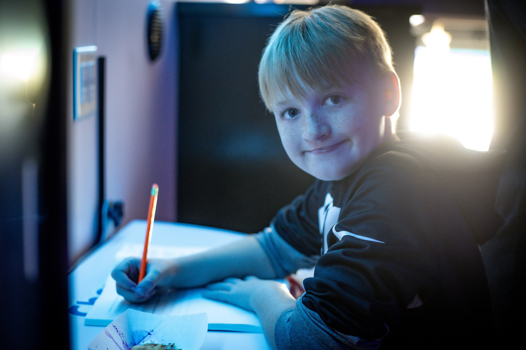 BOY HOLDING A PENCIL