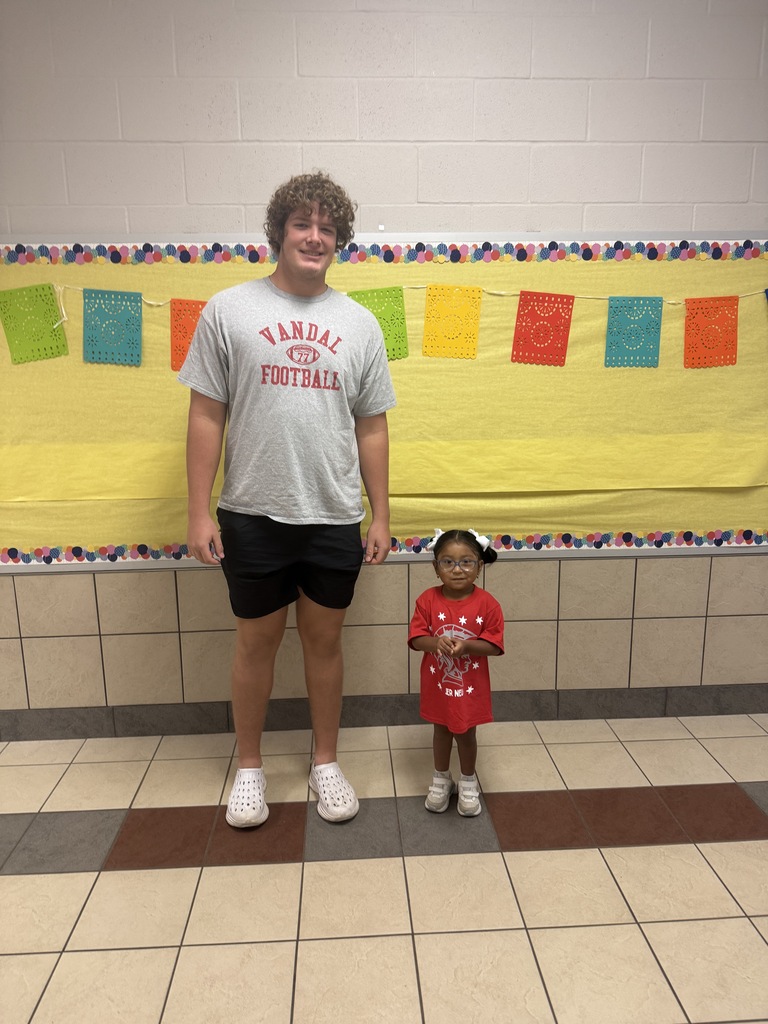 Photo of a high school boy and a pre-k girl
