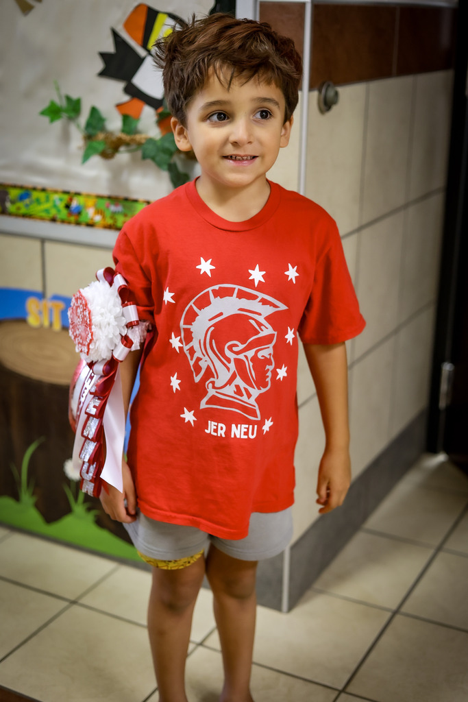 Elementary student wearing a mum / garter 