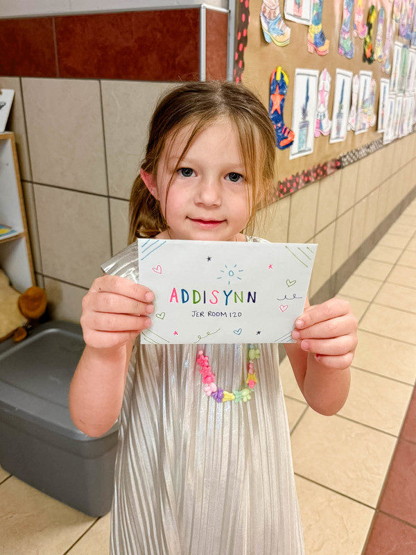 students holding up their mail