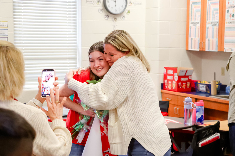 mrs. jones hugged by mrs. ellison