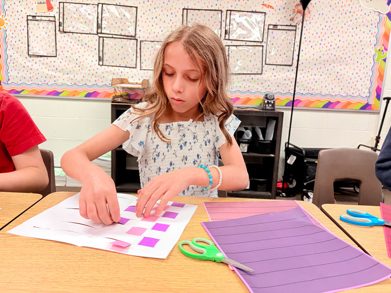 student works on project at desk