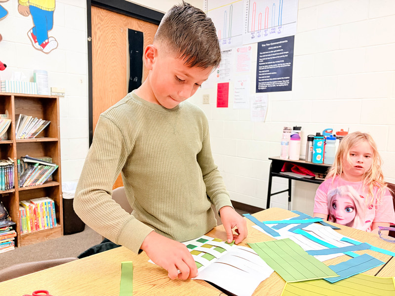 student works on project at desk