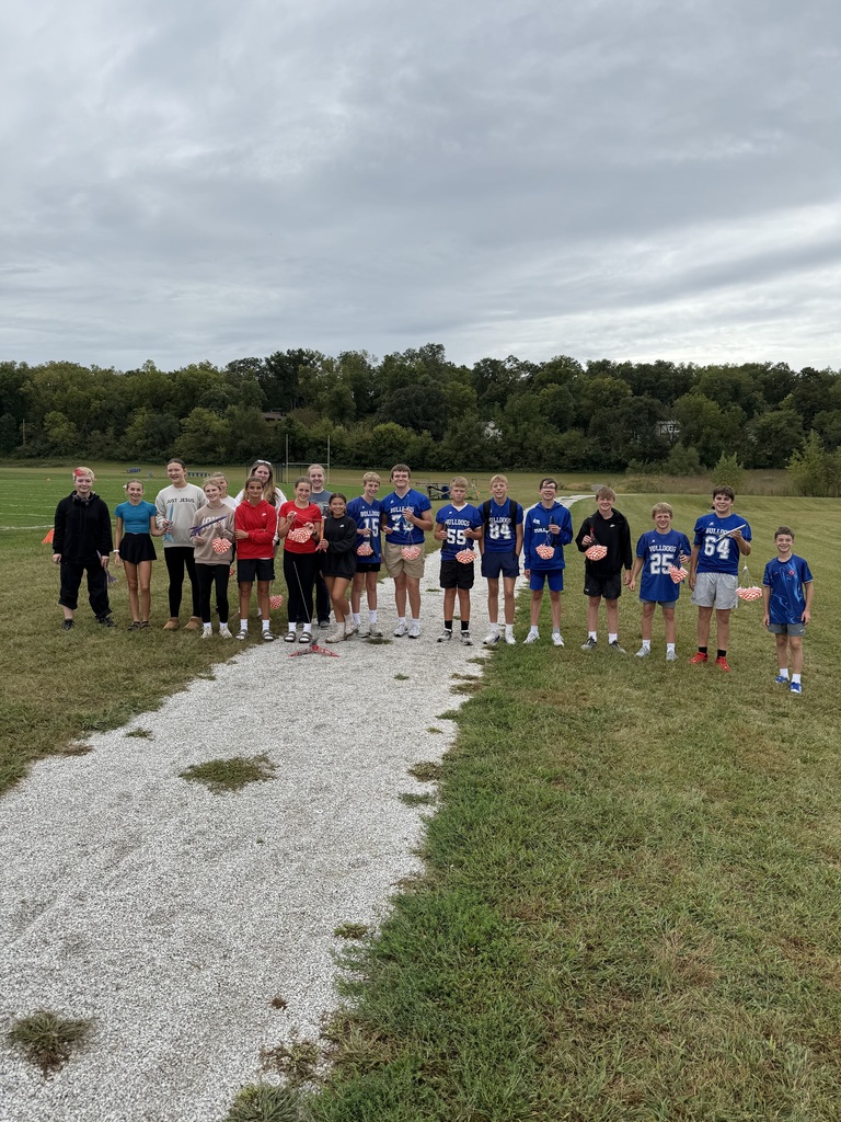 8th graders lined up outside with their rockets