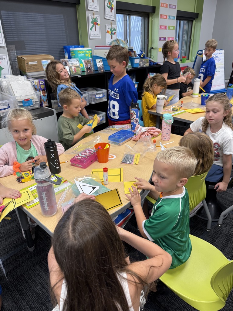 Kindergarten and 3rd grade buddies playing