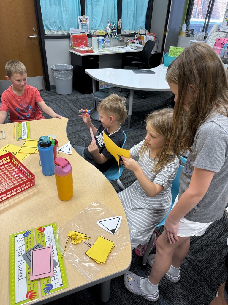 Kindergarten and 3rd grade buddies playing