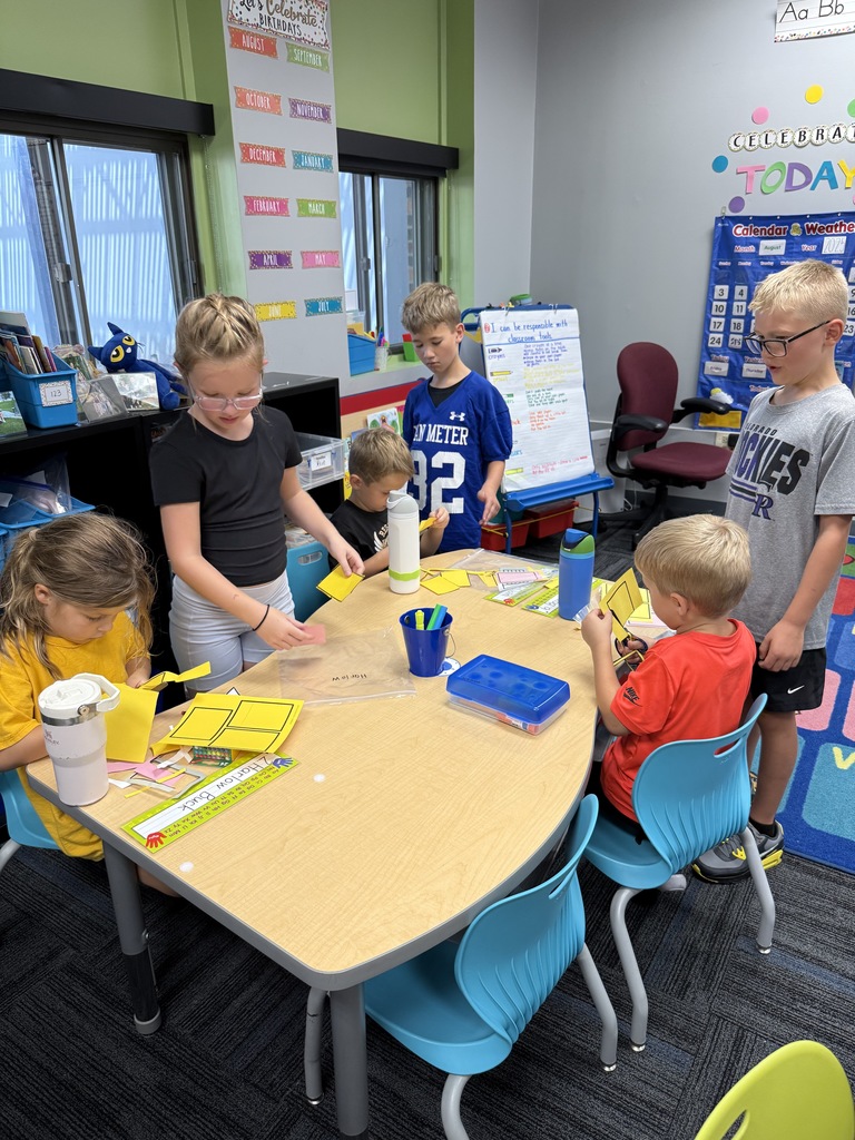 Kindergarten and 3rd grade buddies playing