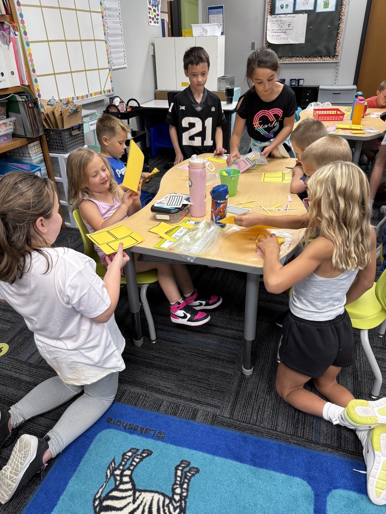 Kindergarten and 3rd grade buddies playing