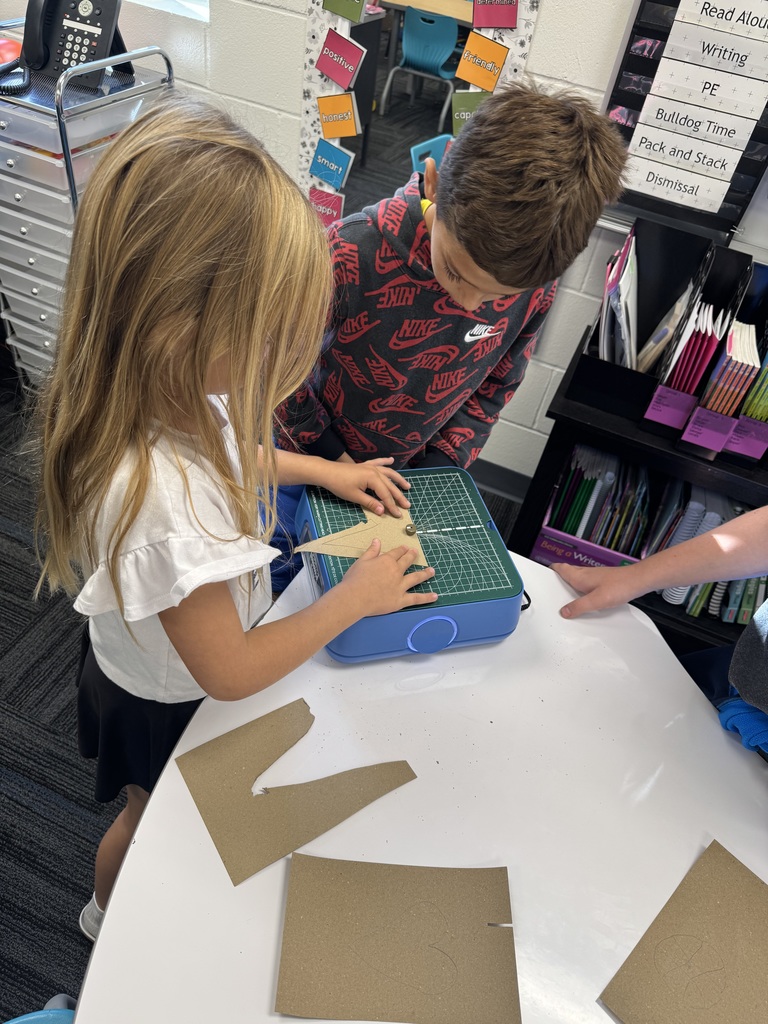 Two students using the Chompsaw.