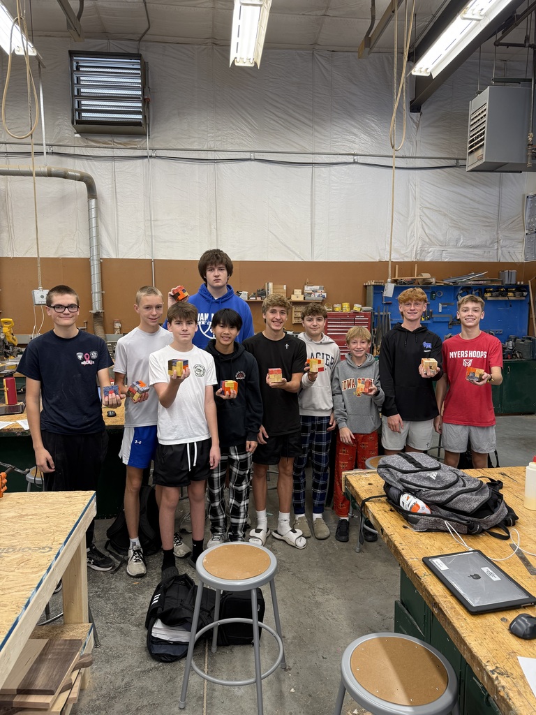 10 students smiling and holding their cubes!