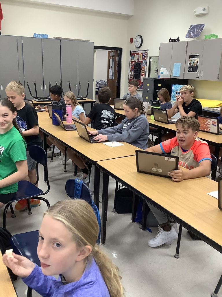 Students sitting at their desks searching what to make with their apples.