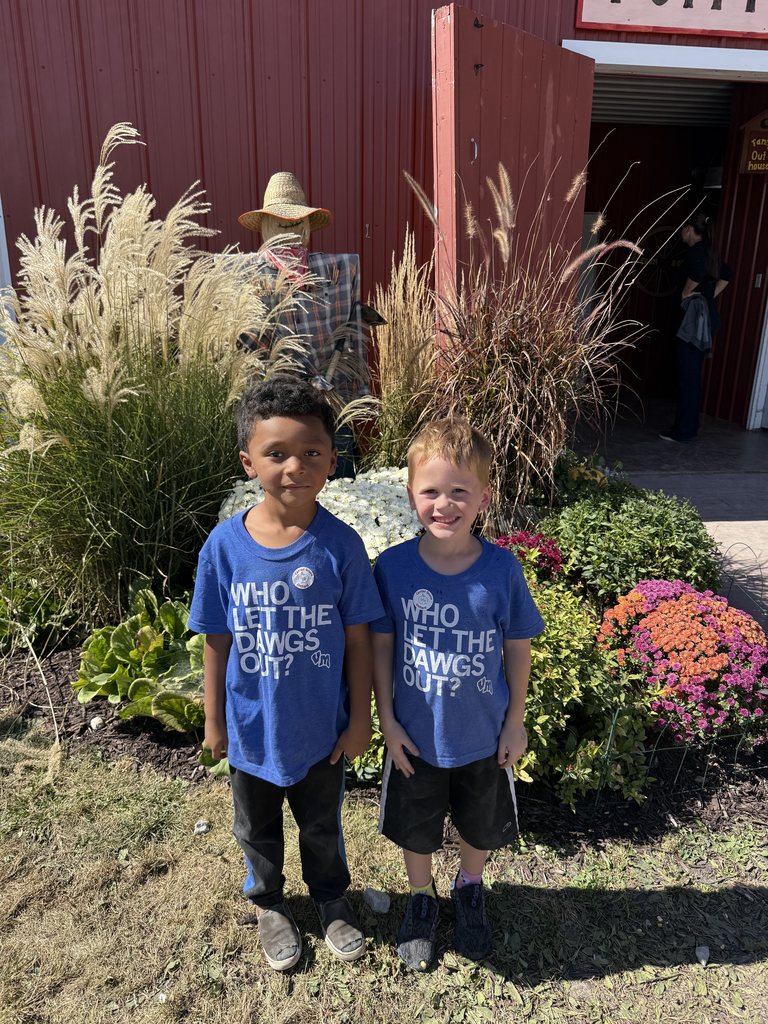 Two students smiling for a picture