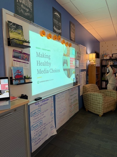 The white board with the presentation title slide saying, "Making Healthy Media Choices"