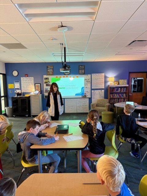 Students listening to the speaker talk.