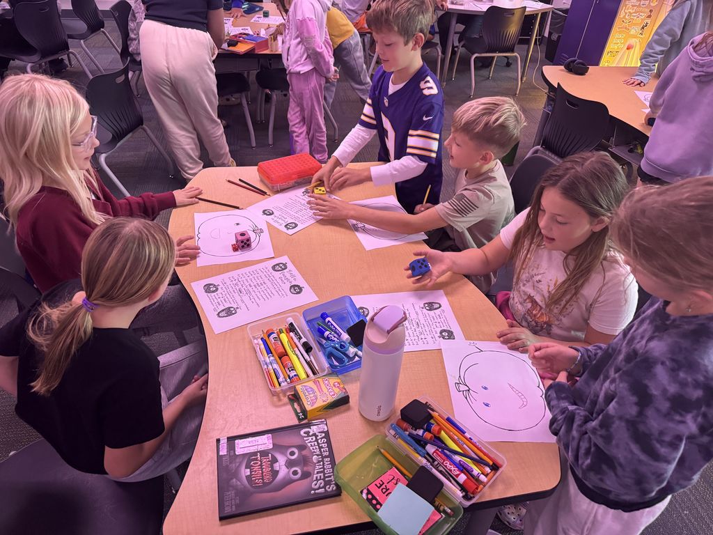 Three pairs of students playing the game at the same table.