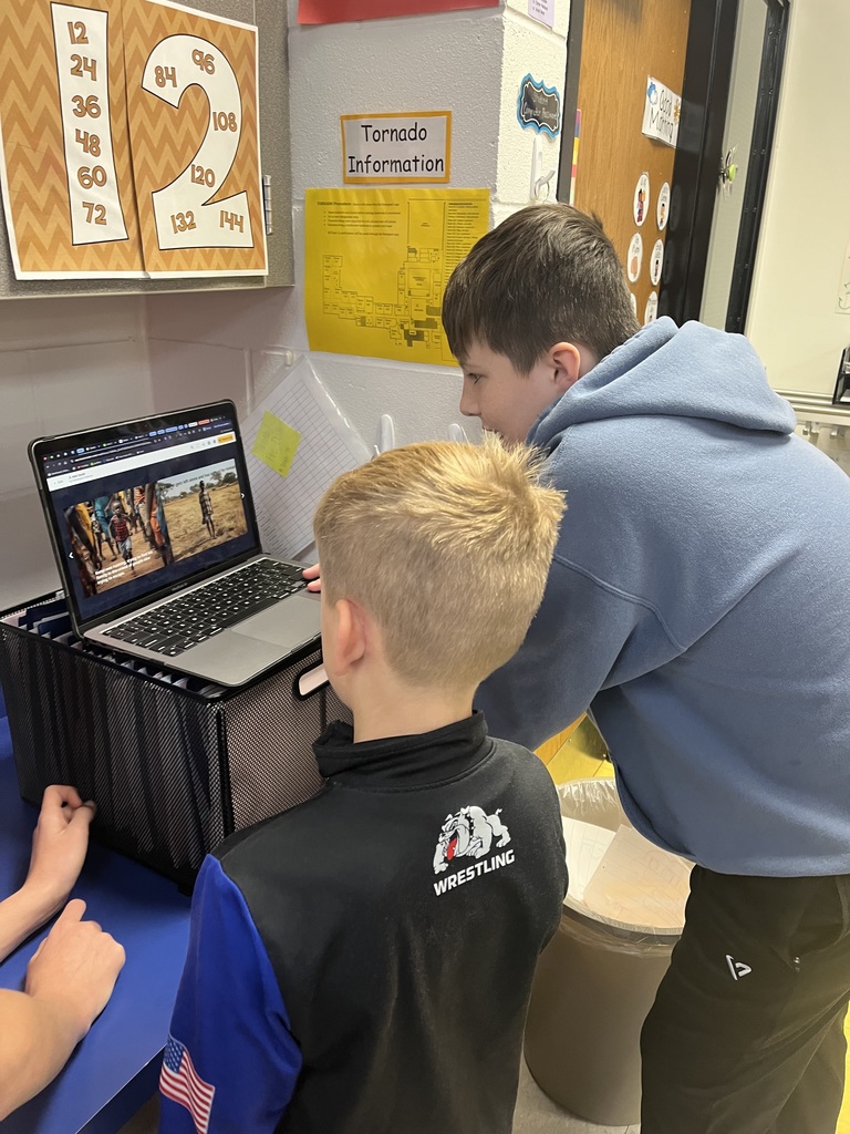 A 7th grader sharing his ebook with a 3rd grader.