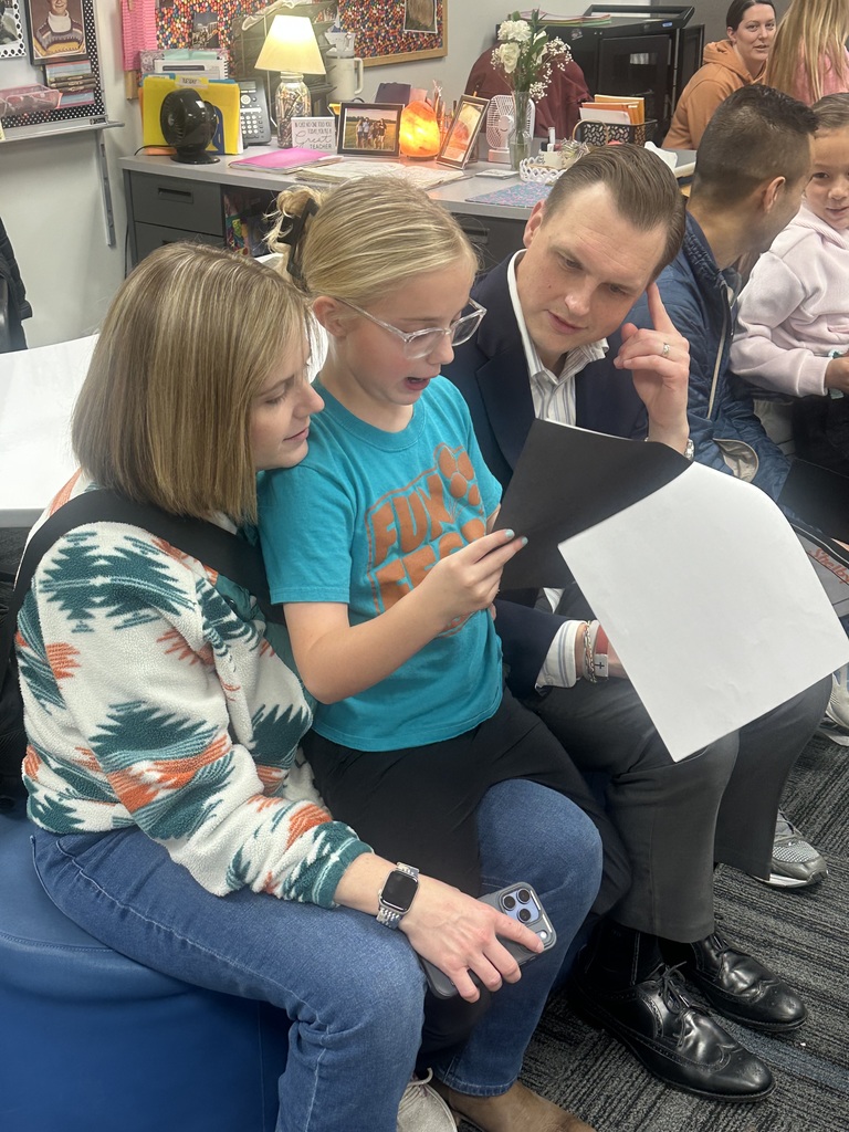 A student with two of their family members