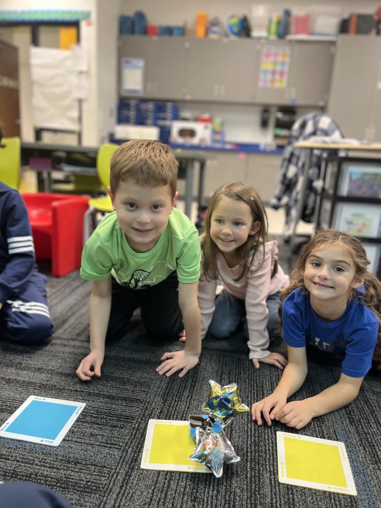 Three students on the floor with their game!
