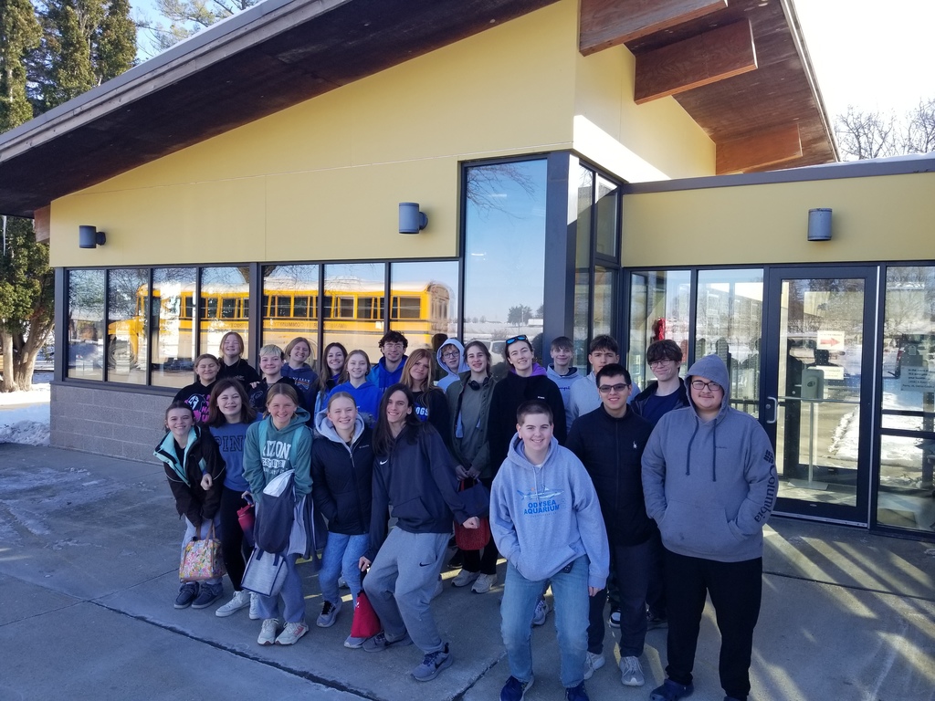 A group picture outside of the building