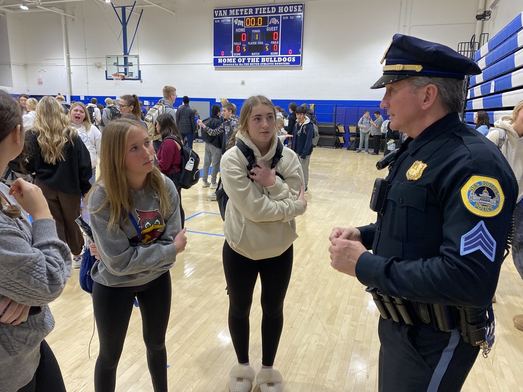 Sargent Paul Parizek talking to students in the gym