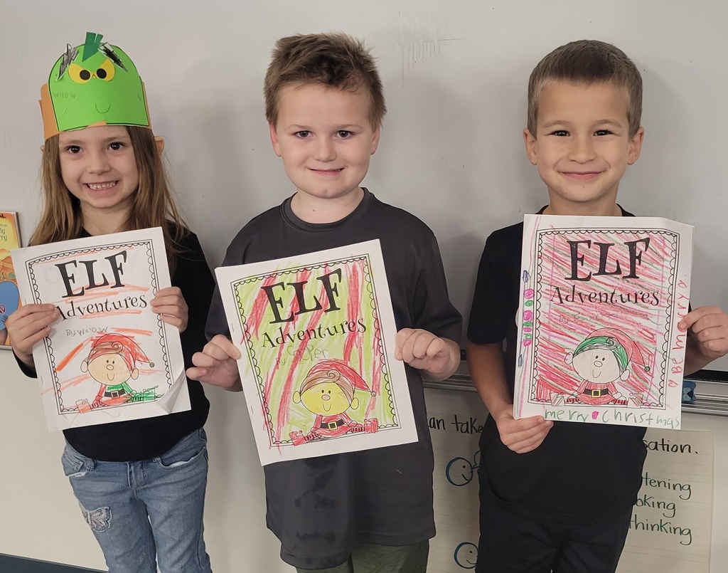 Three students with their Elf Adventures Journals